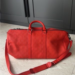 Authentic Louis Vuitton Duffle red/orange duffle